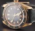 Tudor Black Bay Bronze M79250BA-0001, slate-gray dial and bezel with black nubuck strap, left three-quarter front view