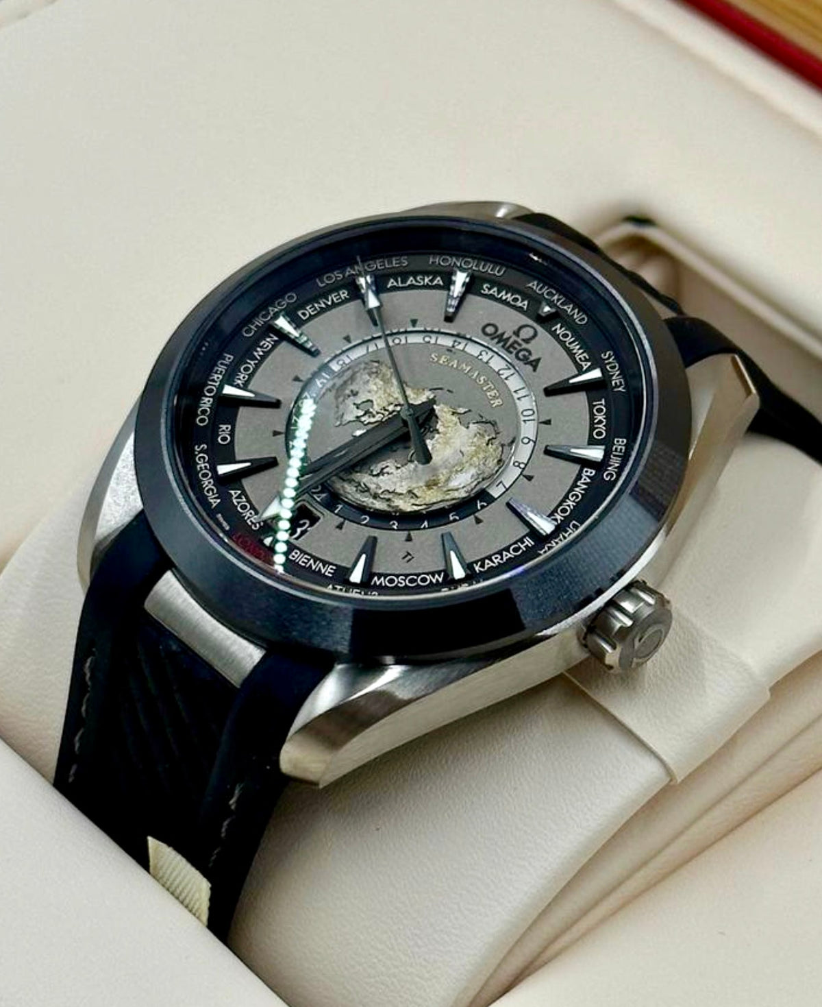 Omega Aqua Terra Worldtimer titanium case and black rubber strap from the crown-side angle