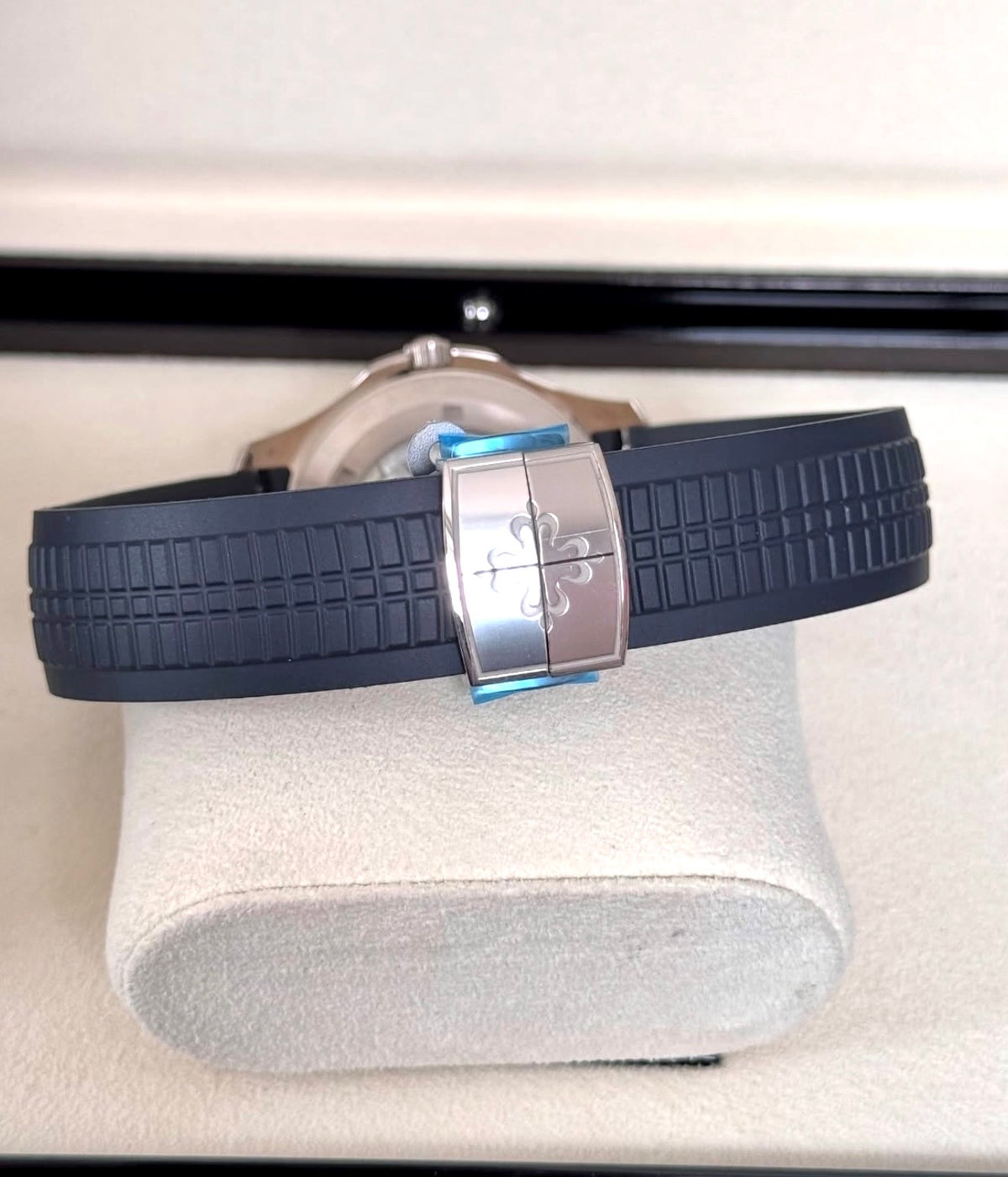 Patek Philippe Aquanaut 5168G-001 in white gold with blue embossed dial and blue composite strap, rear view of the blue strap and deployant clasp