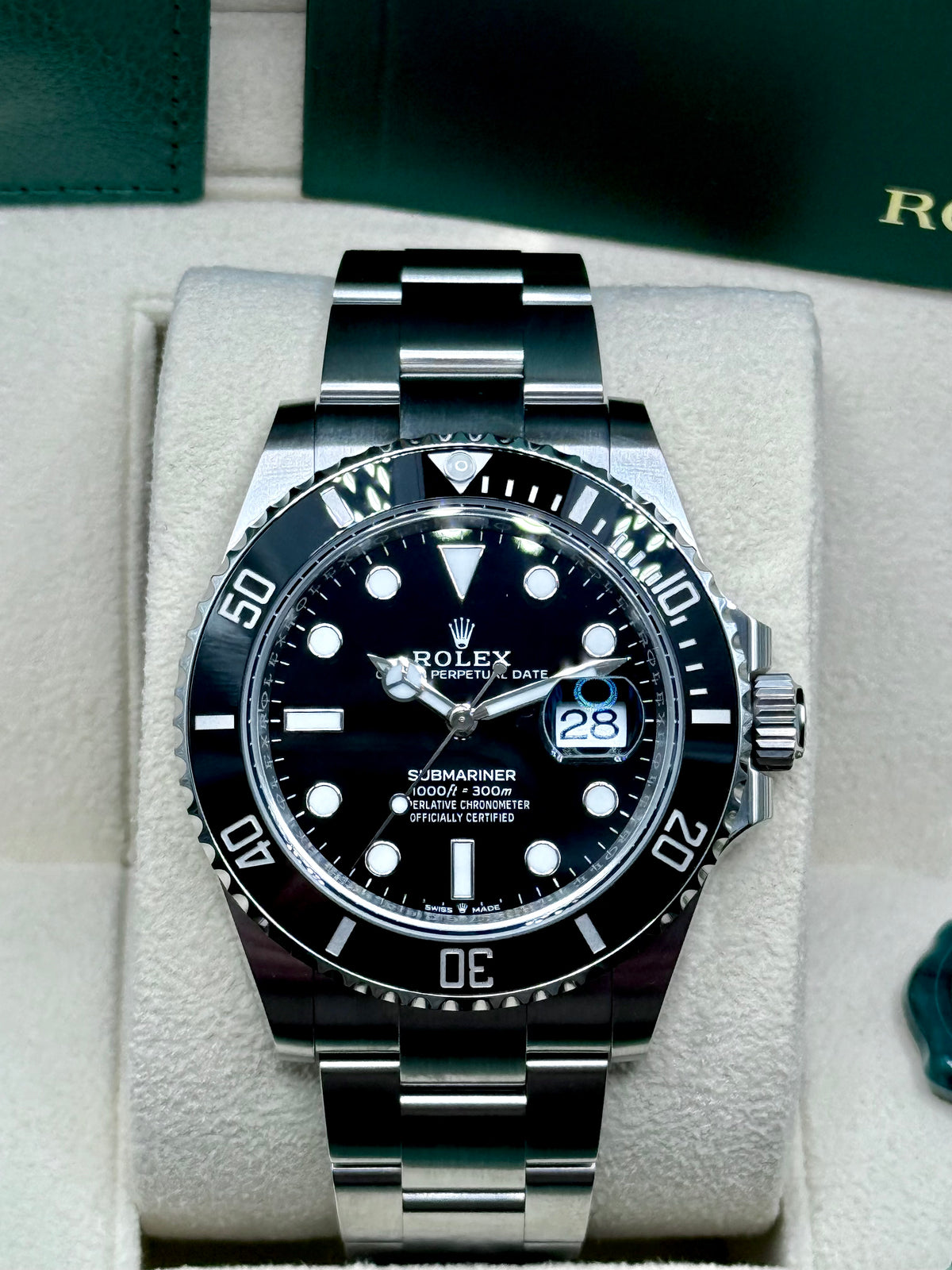 Rolex Submariner Date 126610LN black dial and black bezel, straight-on front view in box