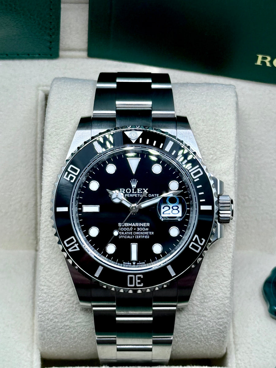 Rolex Submariner Date 126610LN black dial and black bezel, straight-on front view in box
