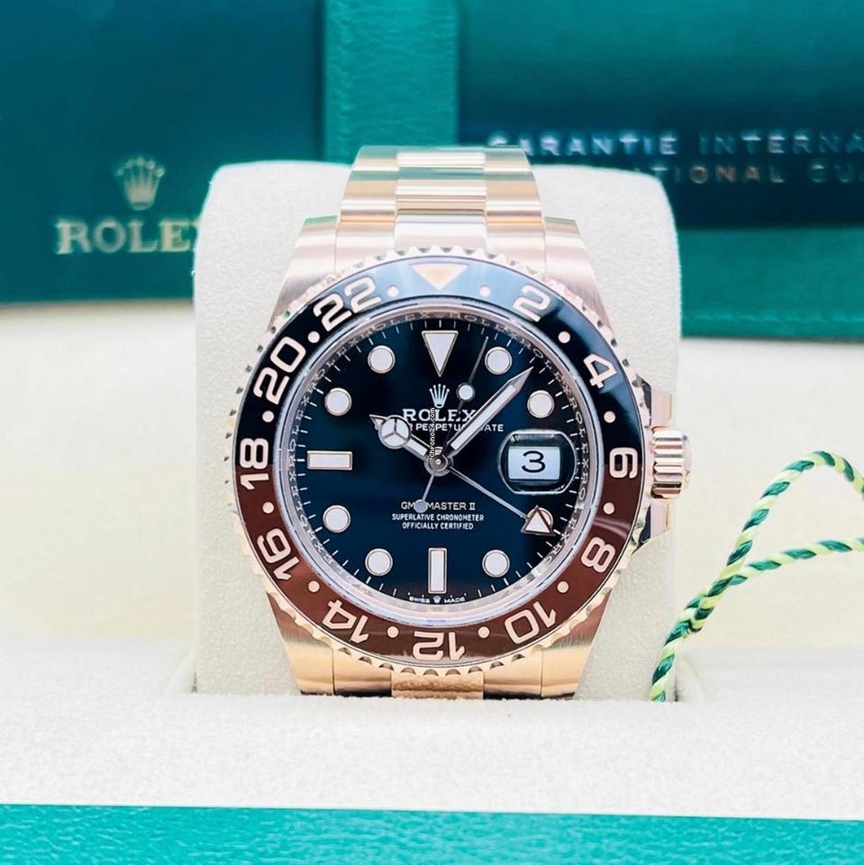Rolex GMT-Master II ref. 126715CHNR in Everose gold with black dial, brown-black bezel and Oyster bracelet, straight-on front view in presentation box