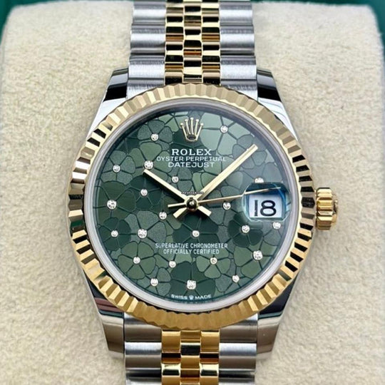 Rolex Datejust 31 Green Floral Diamond Dial 278273, straight-on front view on a display cushion