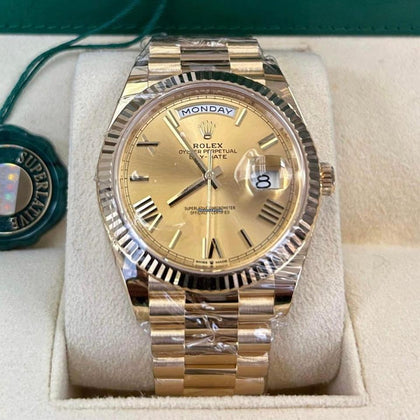 Rolex Day-Date 40 reference 228238 champagne Roman numeral dial on yellow gold President bracelet, straight-on front view