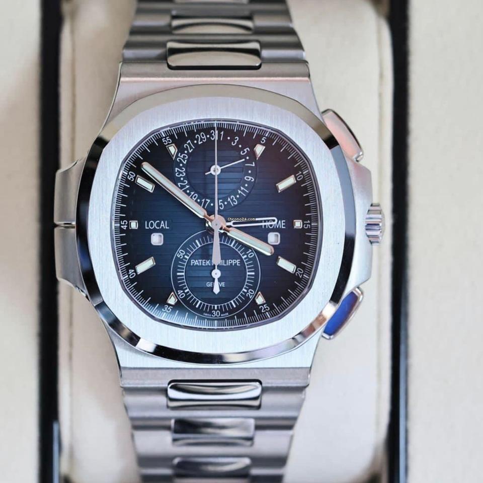 Patek Philippe Nautilus 5990 slash 1A-011 Travel Time chronograph in steel with blue dial
