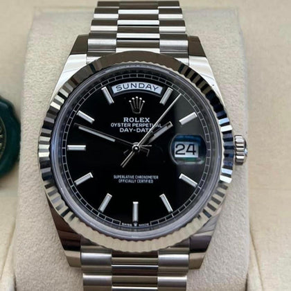 Rolex Day-Date 40 reference 228239 black index dial in white gold on President bracelet, straight-on front view