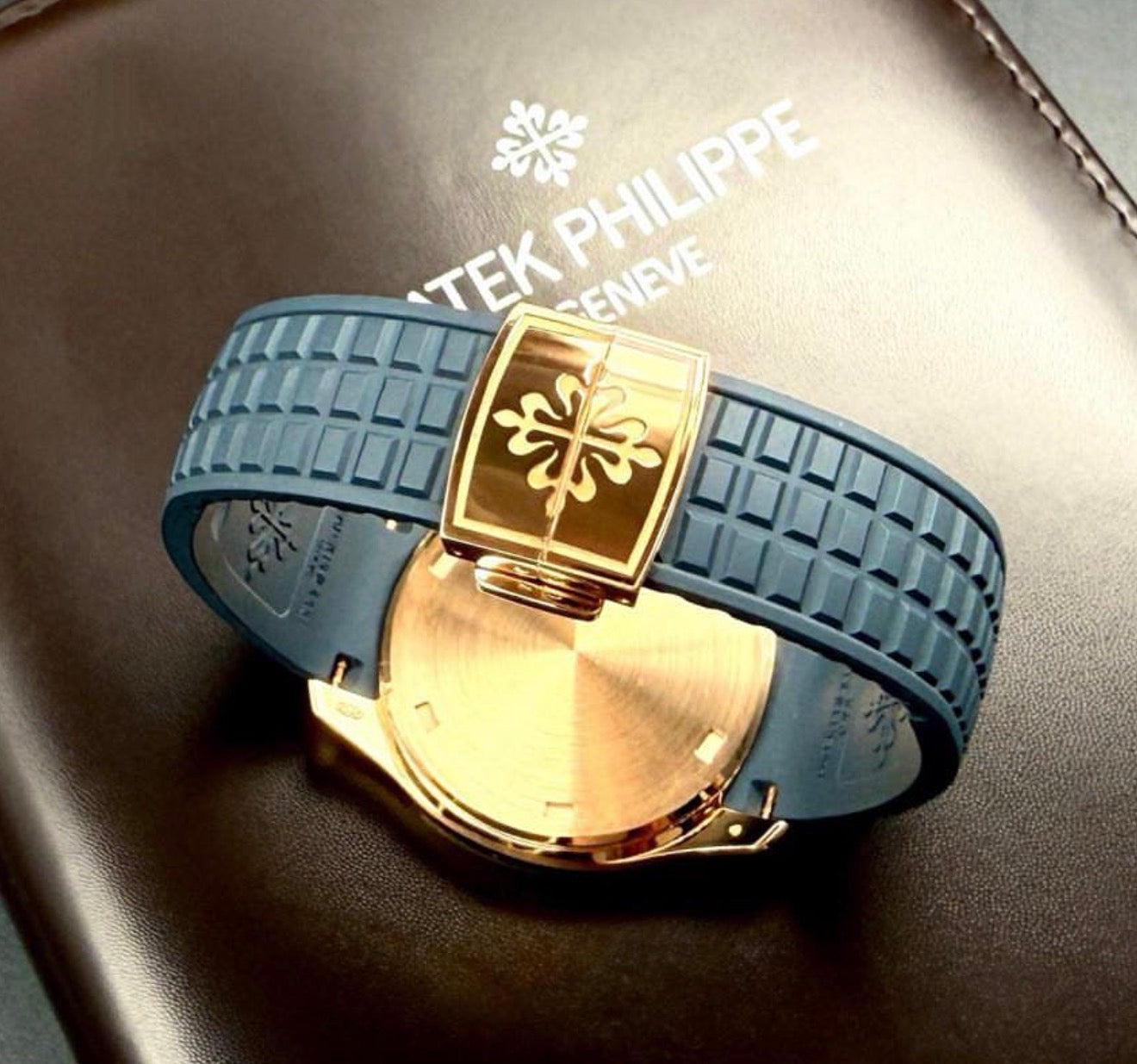Patek Philippe Aquanaut 5269R-001 in rose gold with blue dial and blue composite strap, rear view of the composite strap and deployant clasp