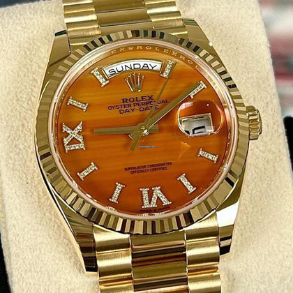 Rolex Day-Date 36 reference 128238 carnelian dial with diamond-set Roman numerals, close straight-on front view