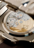 Patek Philippe Nautilus 5811/1G-001 in white gold with blue embossed dial and integrated bracelet, angled sapphire caseback and movement view