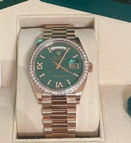 Rolex Day-Date 36 reference 128345RBR aventurine dial and diamond bezel in Everose gold, straight-on front view