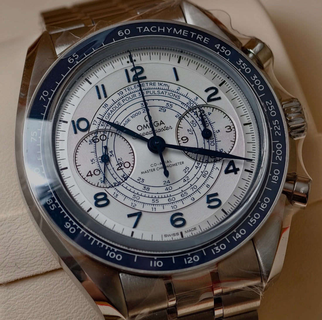 OMEGA Speedmaster Chronoscope 329.30.43.51.02.001 — silver chronograph dial with blue scales and steel bracelet, front view