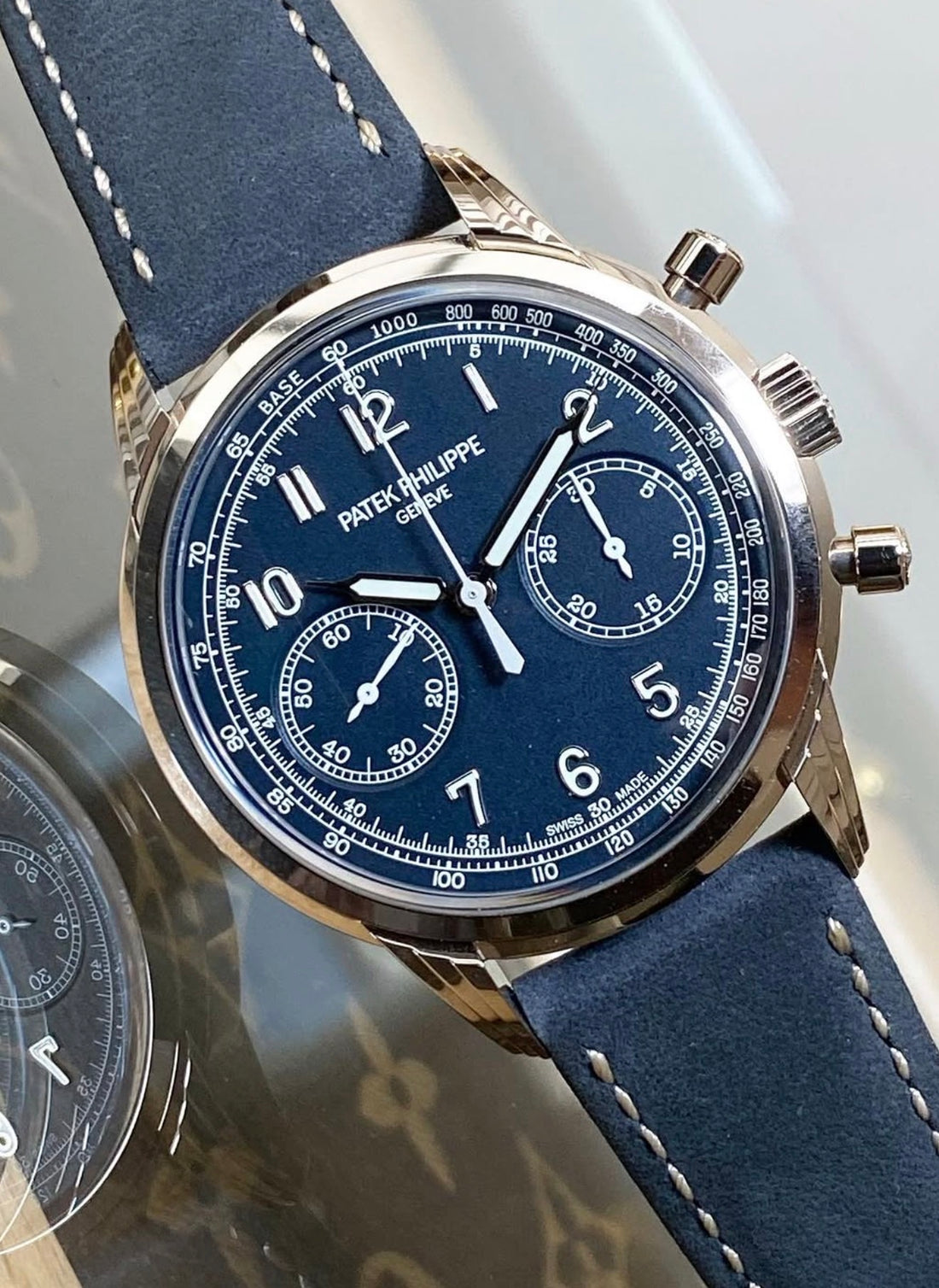 Patek Philippe Chronograph 5172G-001 in white gold with blue dial and blue calfskin strap, angled front close-up
