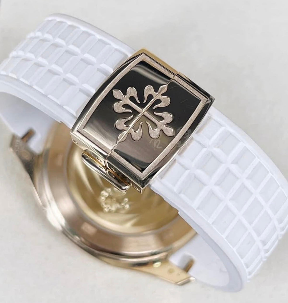 Patek Philippe Aquanaut Luce 5268/200R-001, rose gold, white dial and strap, rear view of deployant clasp and sapphire caseback