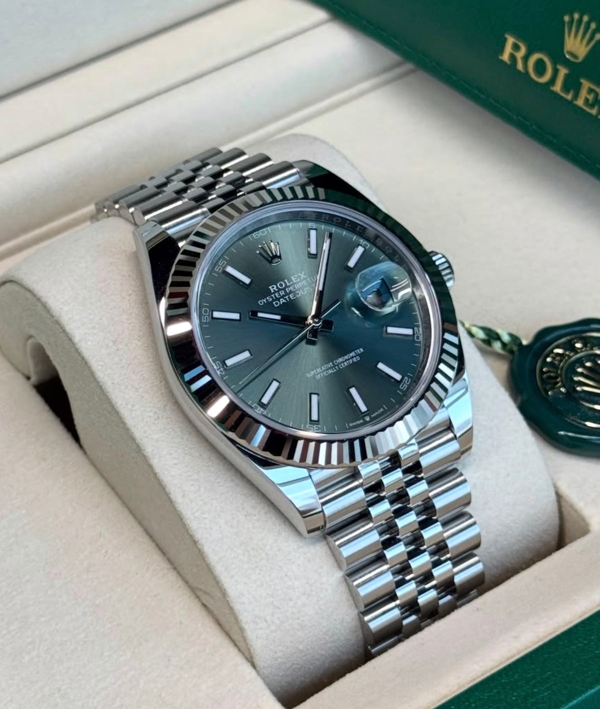 Rolex Datejust 41 126334 White Rolesor, mint-green dial on Jubilee bracelet, angled front view from one side in an open Rolex box