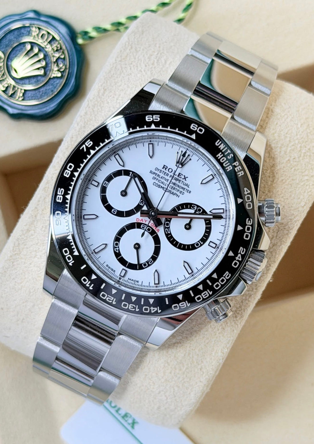 Rolex Cosmograph Daytona 126500LN, white dial, black Cerachrom bezel and Oyster bracelet, left three-quarter front view on cushion