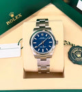 Rolex Oyster Perpetual 277200 — front view in green presentation box with card and hang tag