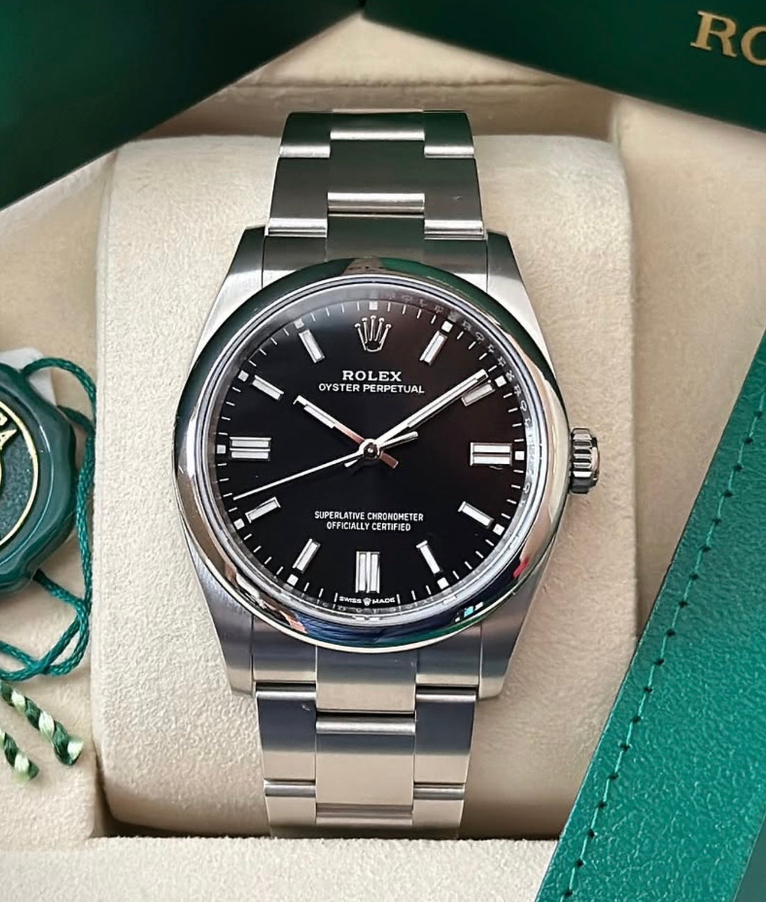 Rolex Oyster Perpetual 36 reference 126000 bright black dial and domed bezel, straight-on front view