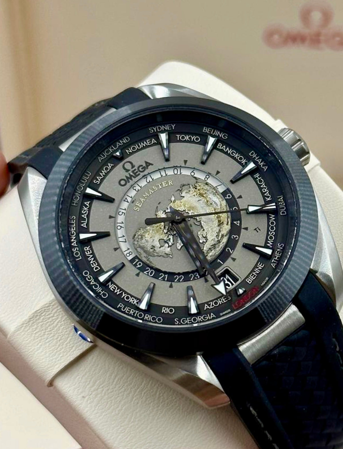 Close angled view of the Omega Aqua Terra Worldtimer black-and-grey worldtimer dial