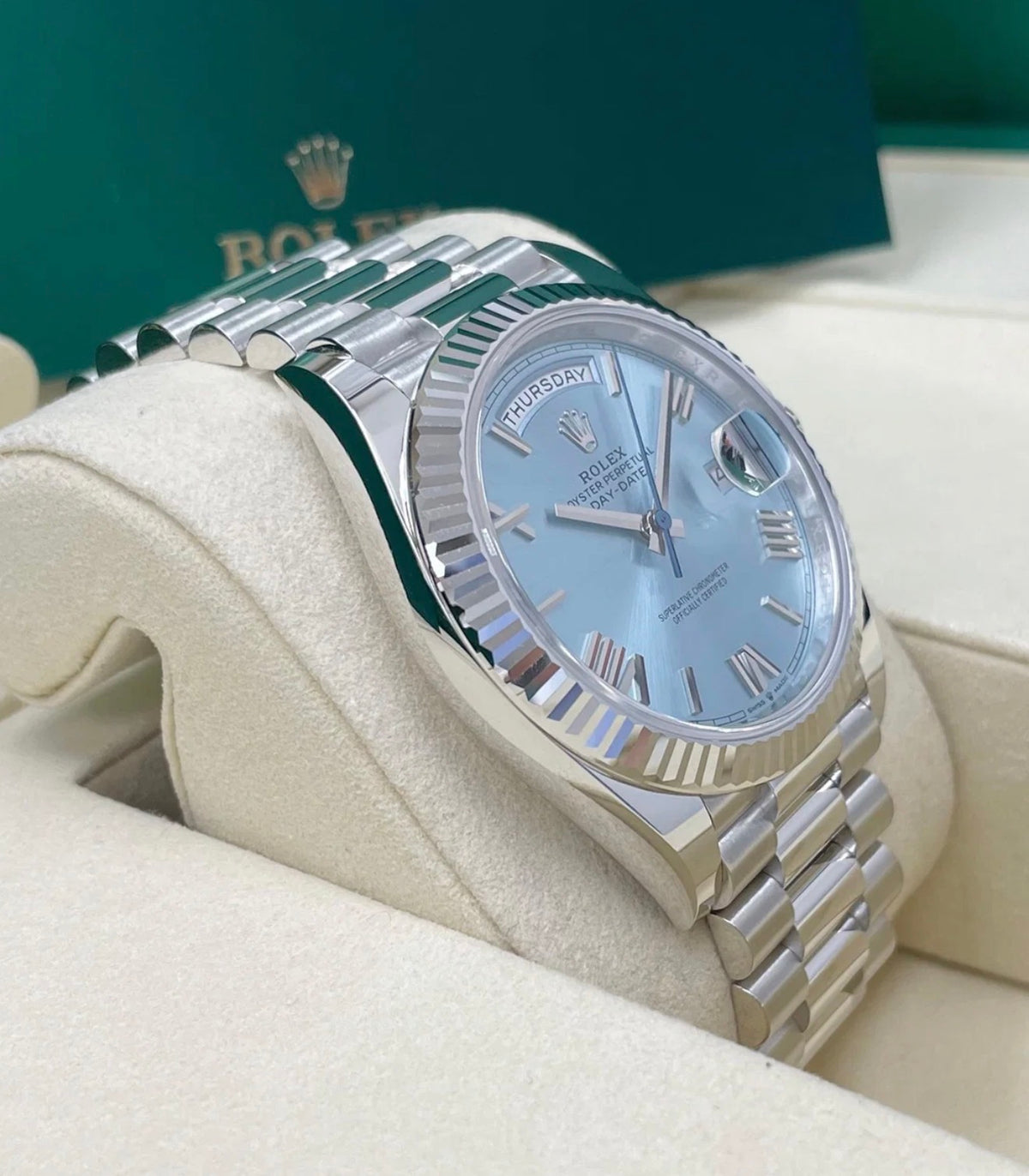 Rolex Day-Date 40 228236 ice-blue Roman dial, low three-quarter view in presentation box