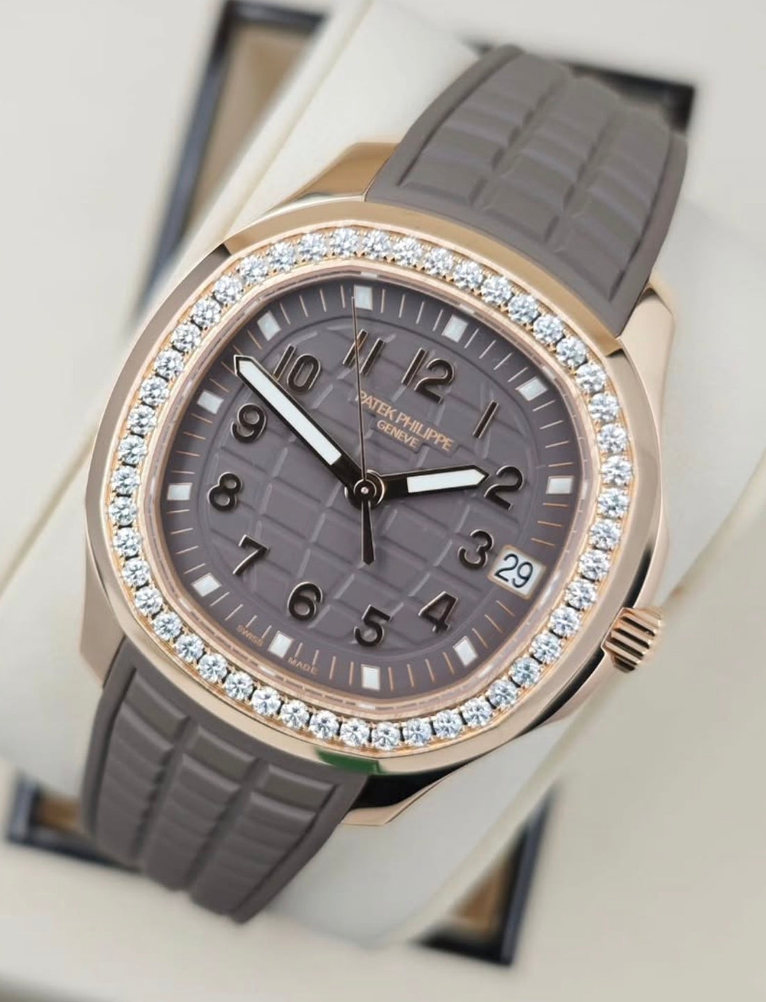 Patek Philippe Aquanaut Luce 5268/200R-010 in rose gold with brown dial, diamond bezel and brown composite strap, angled front view
