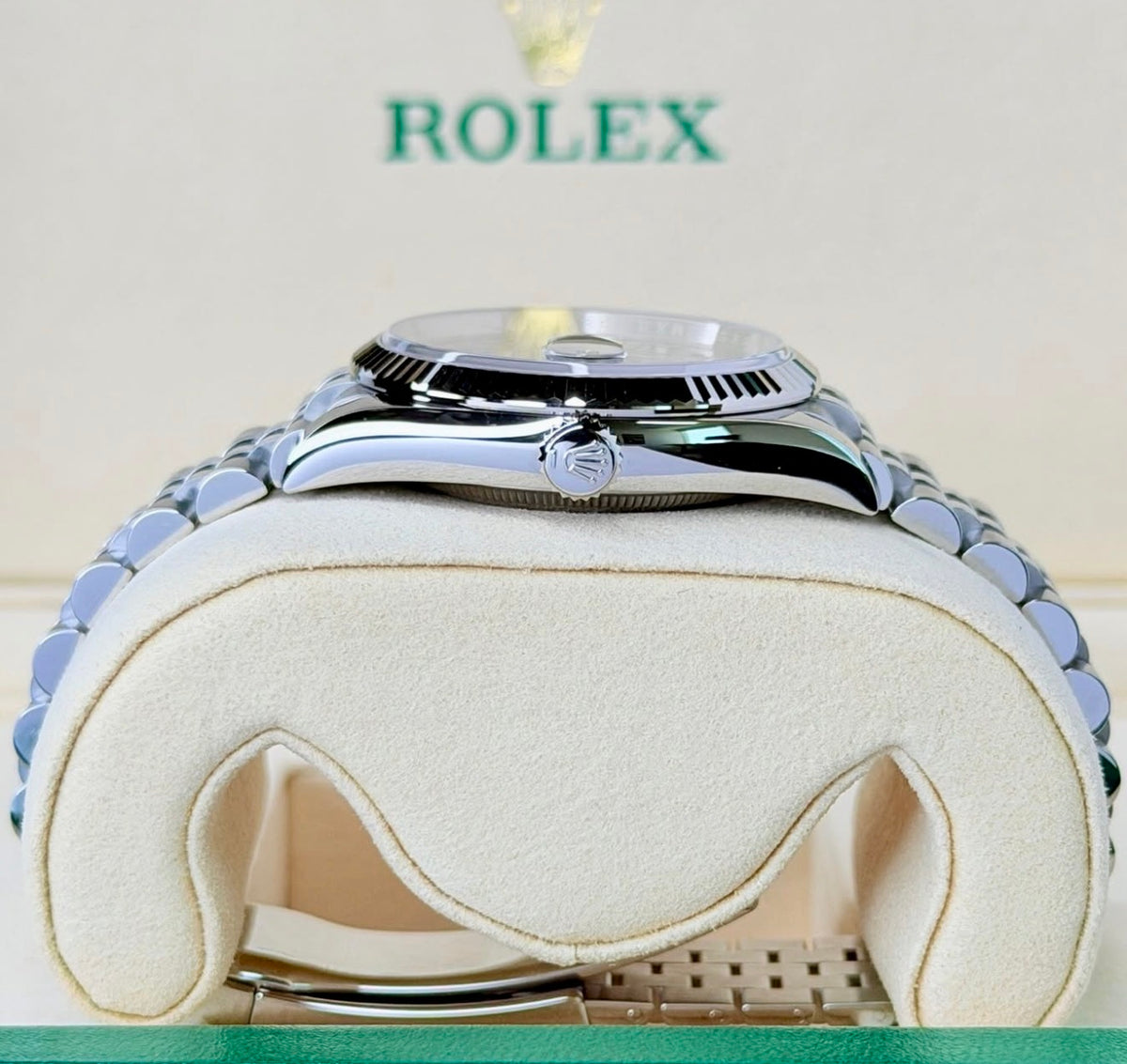 Crown-side profile of the Rolex Datejust 36 126234 showing the Rolex winding crown and fluted white-gold bezel.