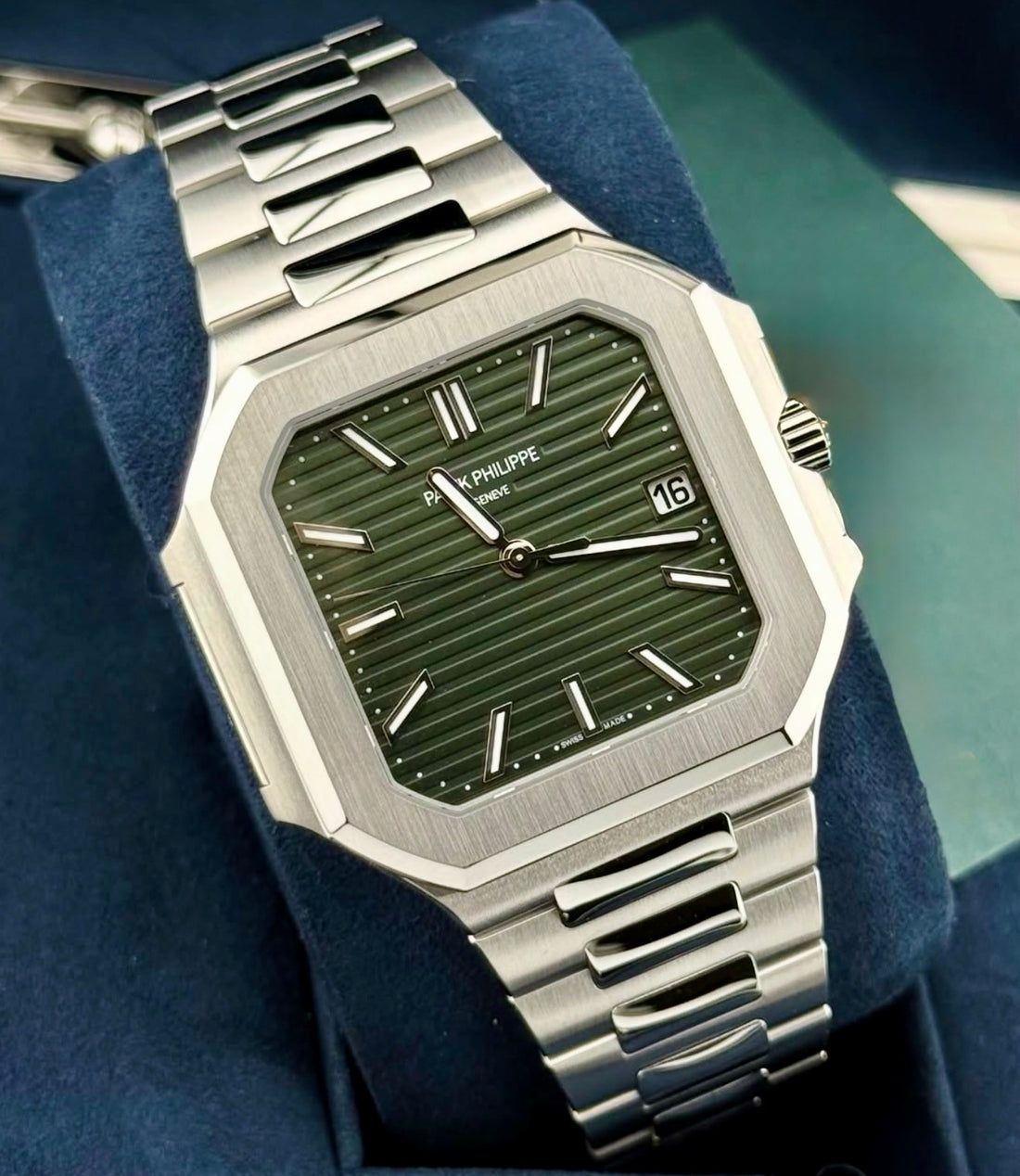 Patek Philippe Cubitus 5821/1A-001 three-quarter front view on cushion with olive-green dial and steel bracelet