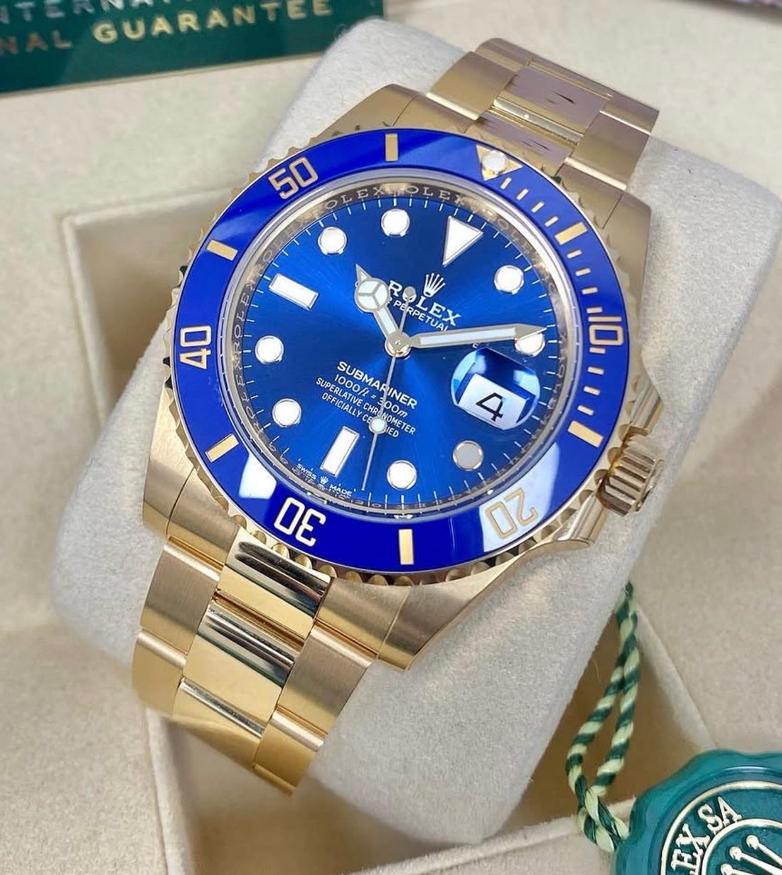 Rolex Submariner Date reference 126618LB blue dial and blue Cerachrom bezel on yellow-gold Oyster bracelet, front view in presentation box