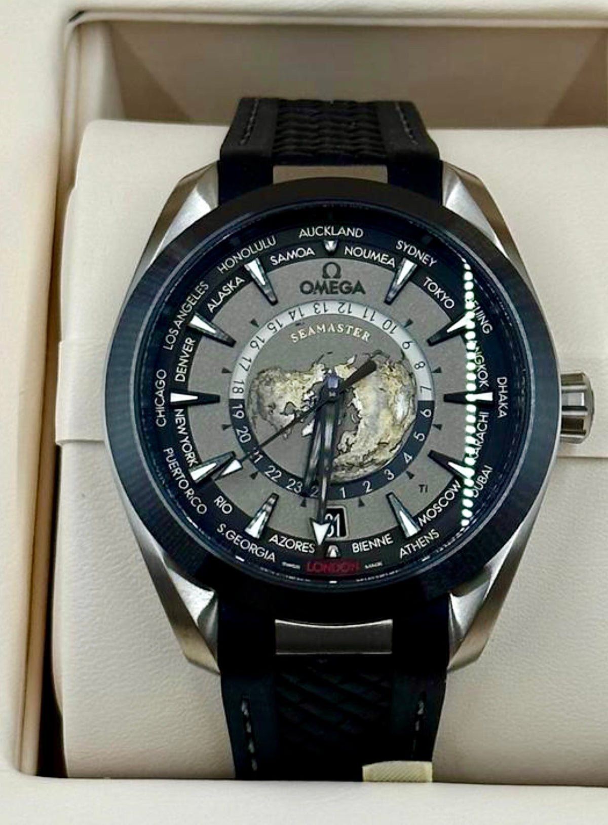 Omega Aqua Terra Worldtimer 220.92.43.22.99.001 front view with titanium case, black dial and rubber strap