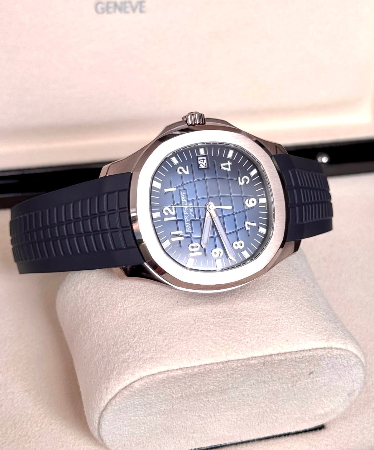 Patek Philippe Aquanaut 5168G-001 in white gold with blue embossed dial and blue composite strap, horizontal crown-side three-quarter view