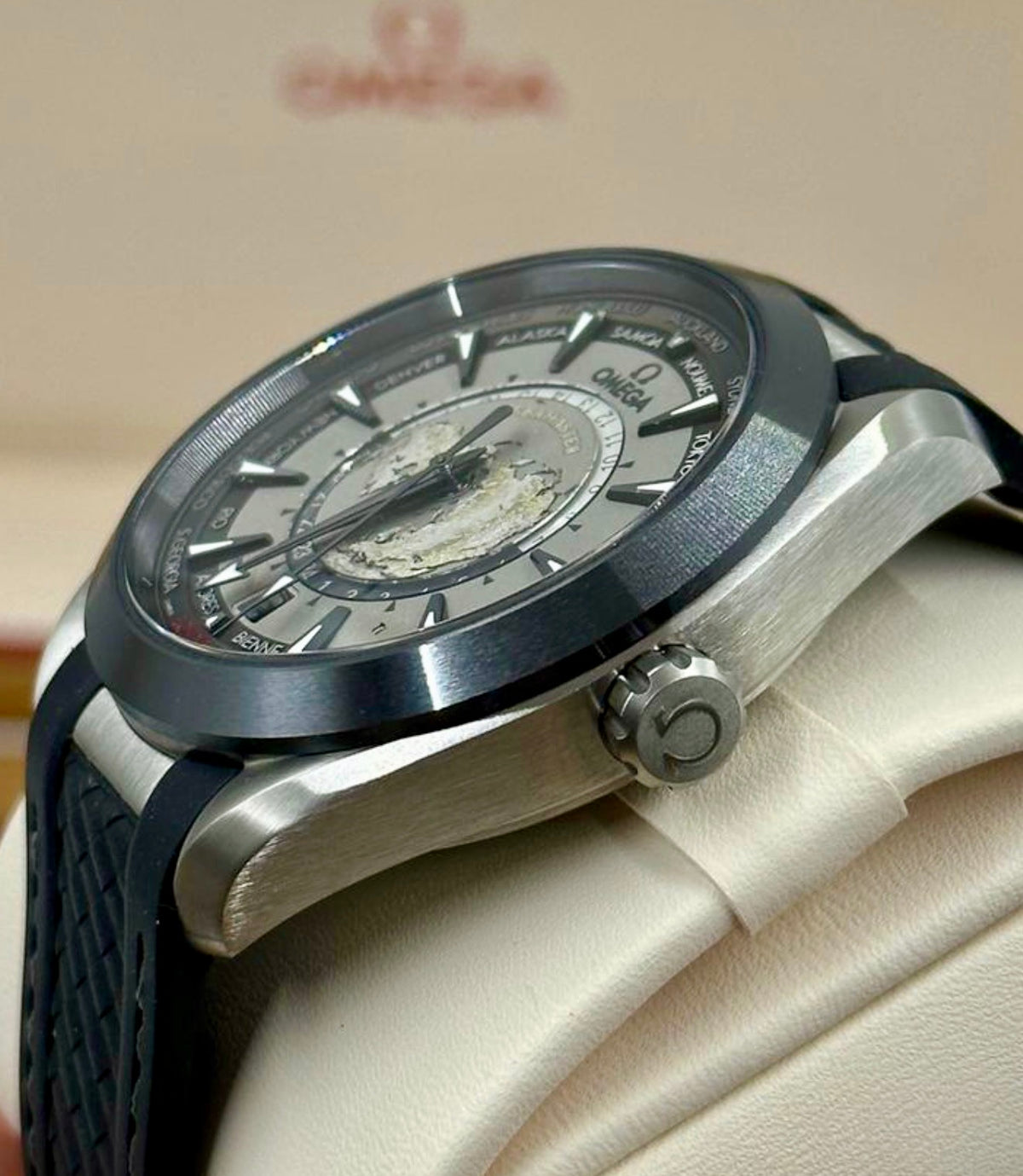 Crown-side profile of the Omega Aqua Terra Worldtimer showing its brushed titanium case and case thickness