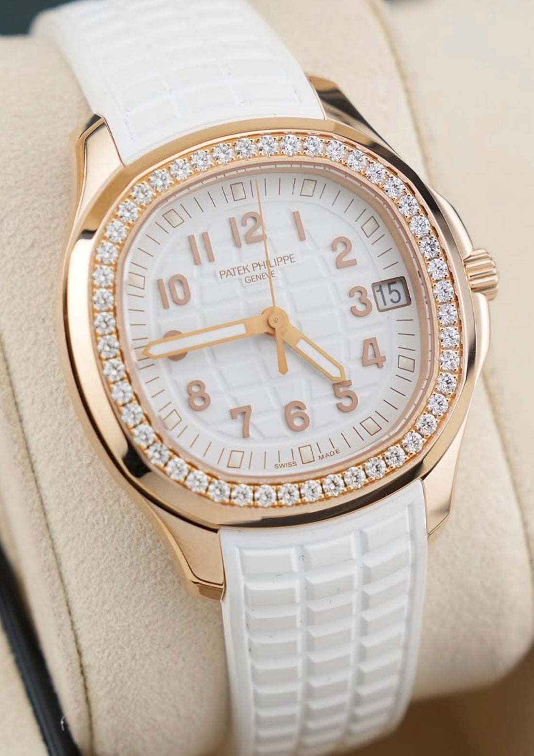 Patek Philippe Aquanaut Luce 5268/200R-001 in rose gold with white dial, diamond bezel and white composite strap, angled front close-up
