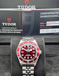 Tudor Black Bay 58 M7939A1A0RU-0002, burgundy dial and bezel with five-link steel bracelet, front view with Tudor box, warranty card and booklets