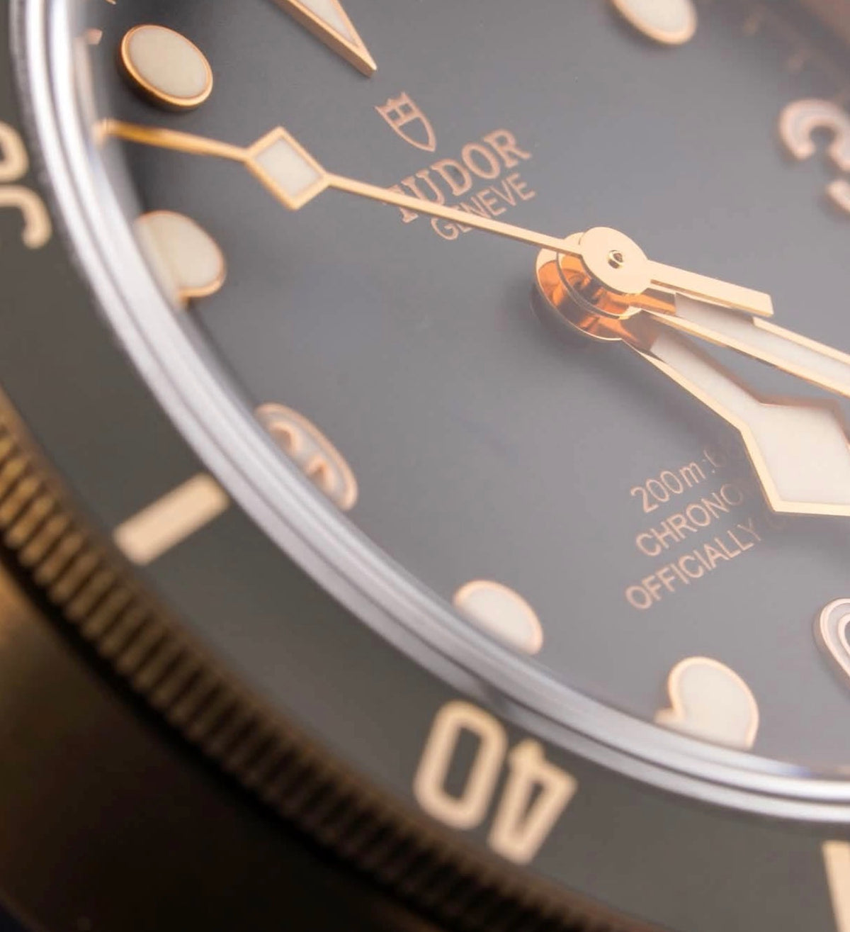 Tudor Black Bay Bronze M79250BA-0001, slate-gray dial and bezel with black nubuck strap, dial text and hands close-up