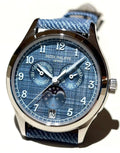Patek Philippe Annual Calendar Moon Phases 4946G-001 with blue-gray dial, angled front view in natural light