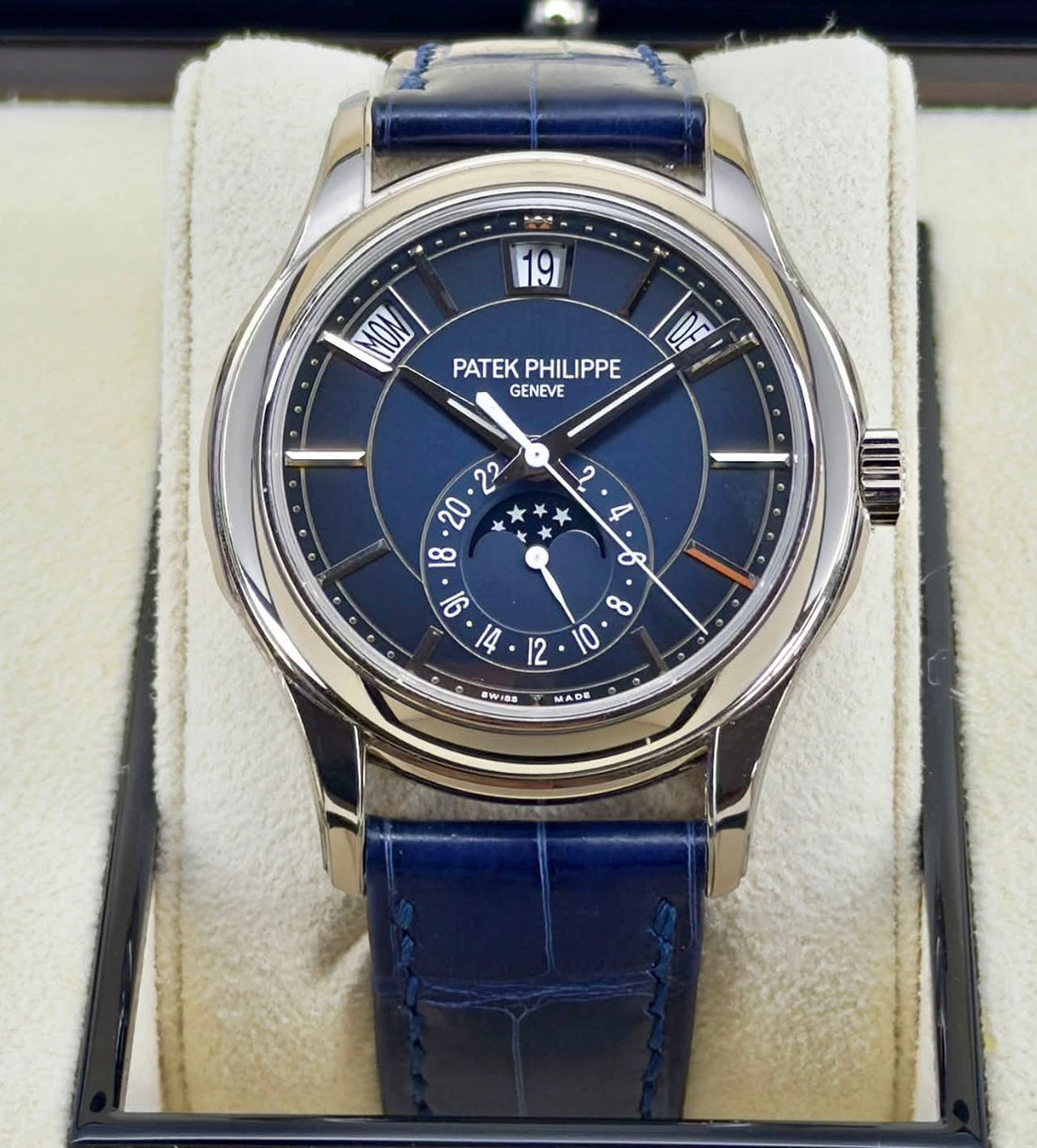 Patek Philippe Complications 5205G-013 — blue annual-calendar dial with moonphase display and blue leather strap