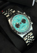 Tudor Black Bay Chrono M79360N-0024 angled turquoise dial with black chronograph counters
