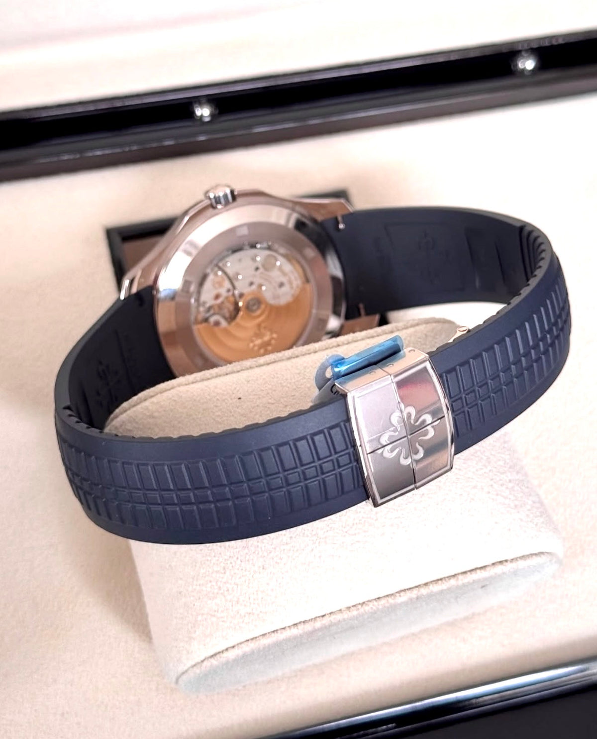 Patek Philippe Aquanaut 5168G-001 in white gold with blue embossed dial and blue composite strap, sapphire caseback and clasp view