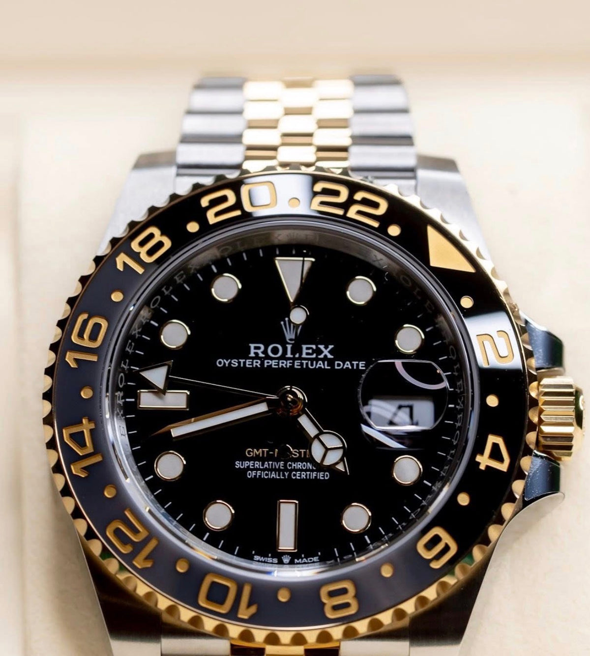 Rolex GMT-Master II ref. 126713GRNR in Yellow Rolesor with black-and-grey Cerachrom bezel and Jubilee bracelet, dial-and-bezel close-up