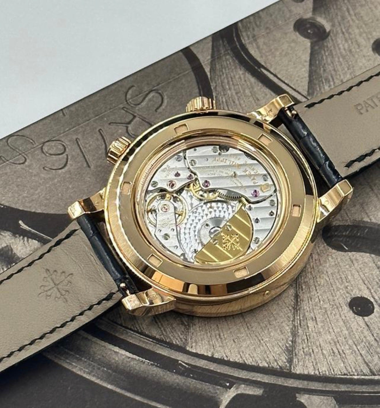 Patek Philippe Celestial 6104R-001 in rose gold with celestial dial, diamond bezel and black strap, movement through sapphire caseback