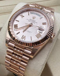 Rolex Day-Date 40 228235 crown-side angled close-up on cushion with Sundust Roman dial and fluted bezel