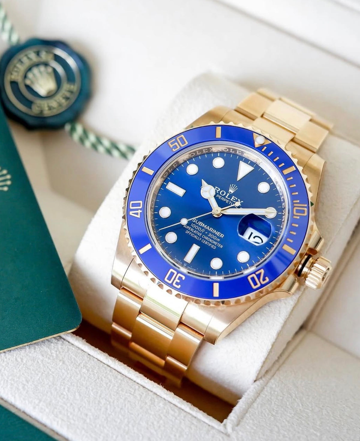 Rolex Submariner Date reference 126618LB blue dial and blue Cerachrom bezel in yellow gold, wider front view with hang tag