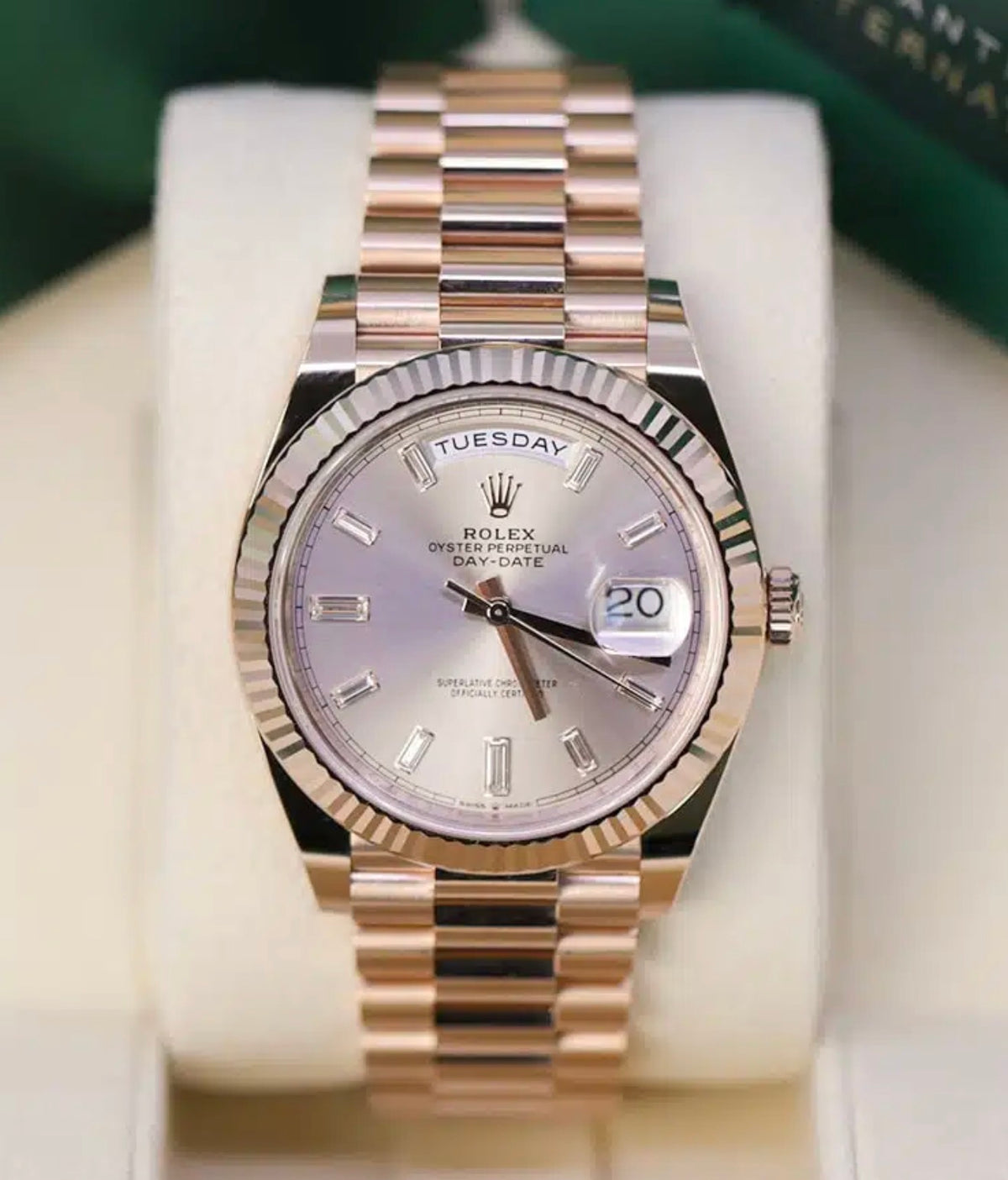 Rolex Day-Date 40 228235 straight-on view with Sundust dial, 10 baguette-cut diamonds and Everose gold President bracelet