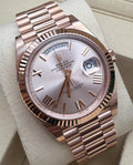 Rolex Day-Date 40 228235 opposite angled close-up on cushion with Sundust Roman dial and President bracelet