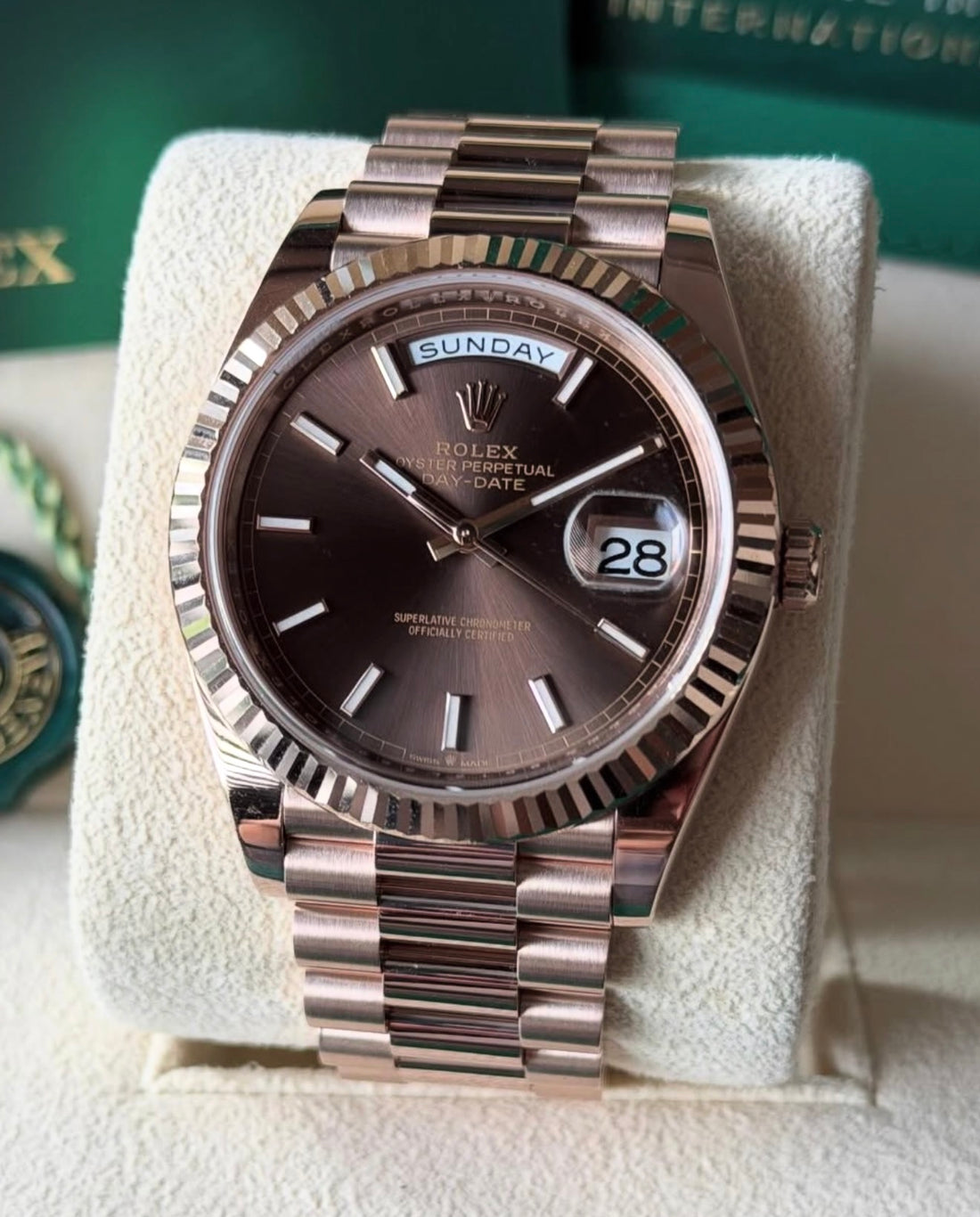 Rolex Day-Date 40 228235, chocolate index dial, Everose gold President bracelet, right three-quarter front view