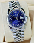 Rolex Datejust 36 126234 with aubergine diamond VI and IX dial, fluted white-gold bezel and Jubilee bracelet.
