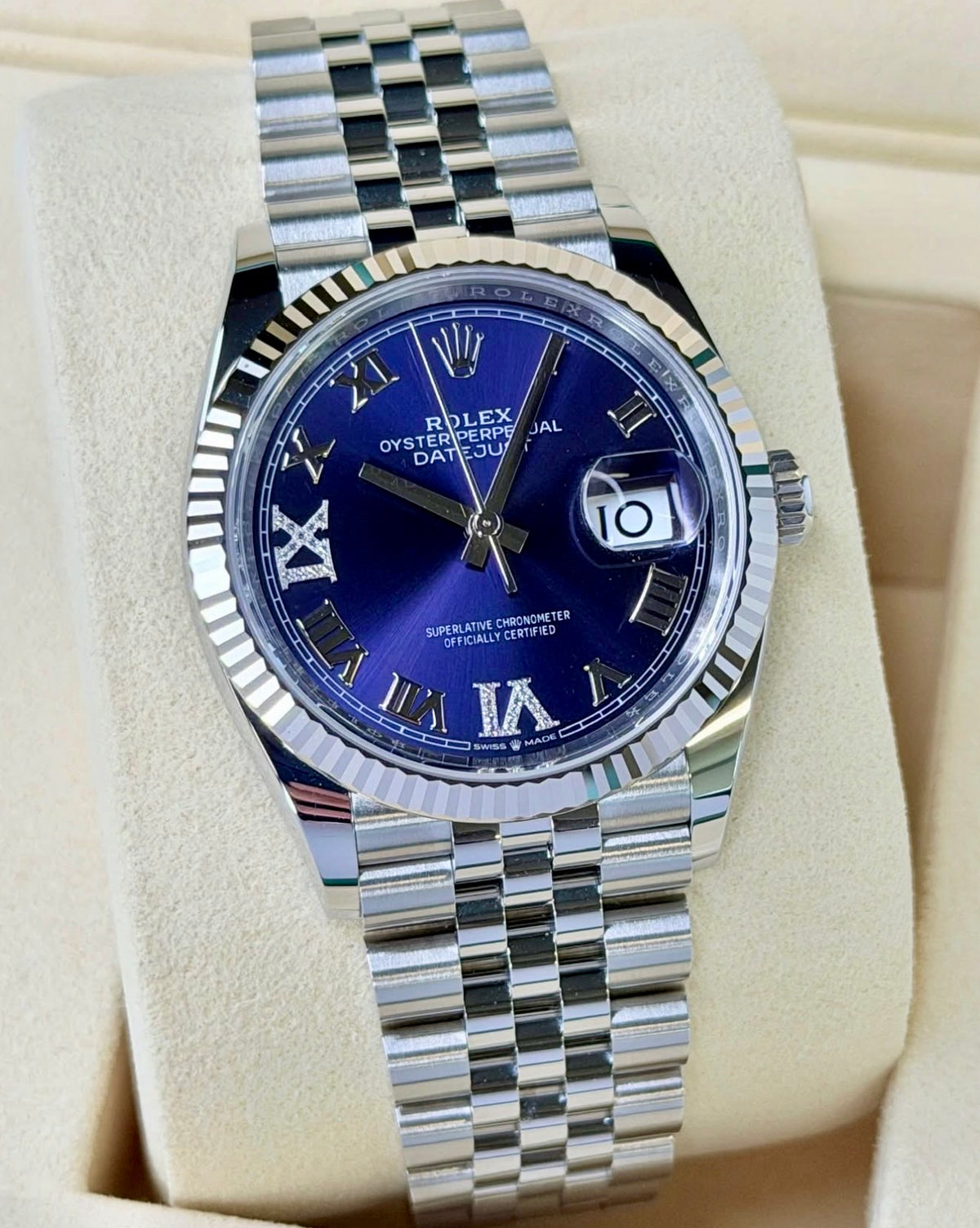 Rolex Datejust 36 126234 with aubergine diamond VI and IX dial, fluted white-gold bezel and Jubilee bracelet.