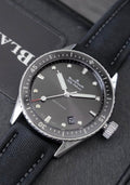 Blancpain watch 5000-1110-B52A — front view on fabric strap beside presentation case