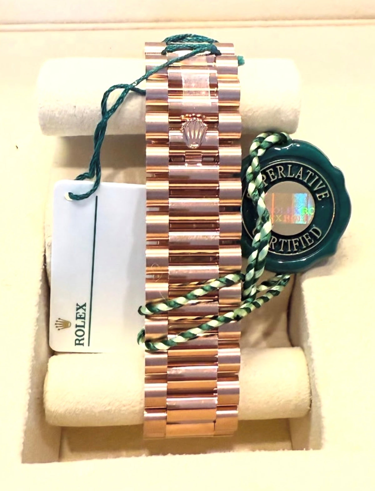 Rolex Day-Date 40 228235 rear bracelet view with Everose gold President bracelet, Crownclasp, hangtag and Rolex seal