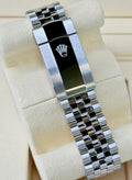 Close-up of the Rolex Datejust 36 126234 Jubilee bracelet clasp with raised Rolex coronet and polished center.