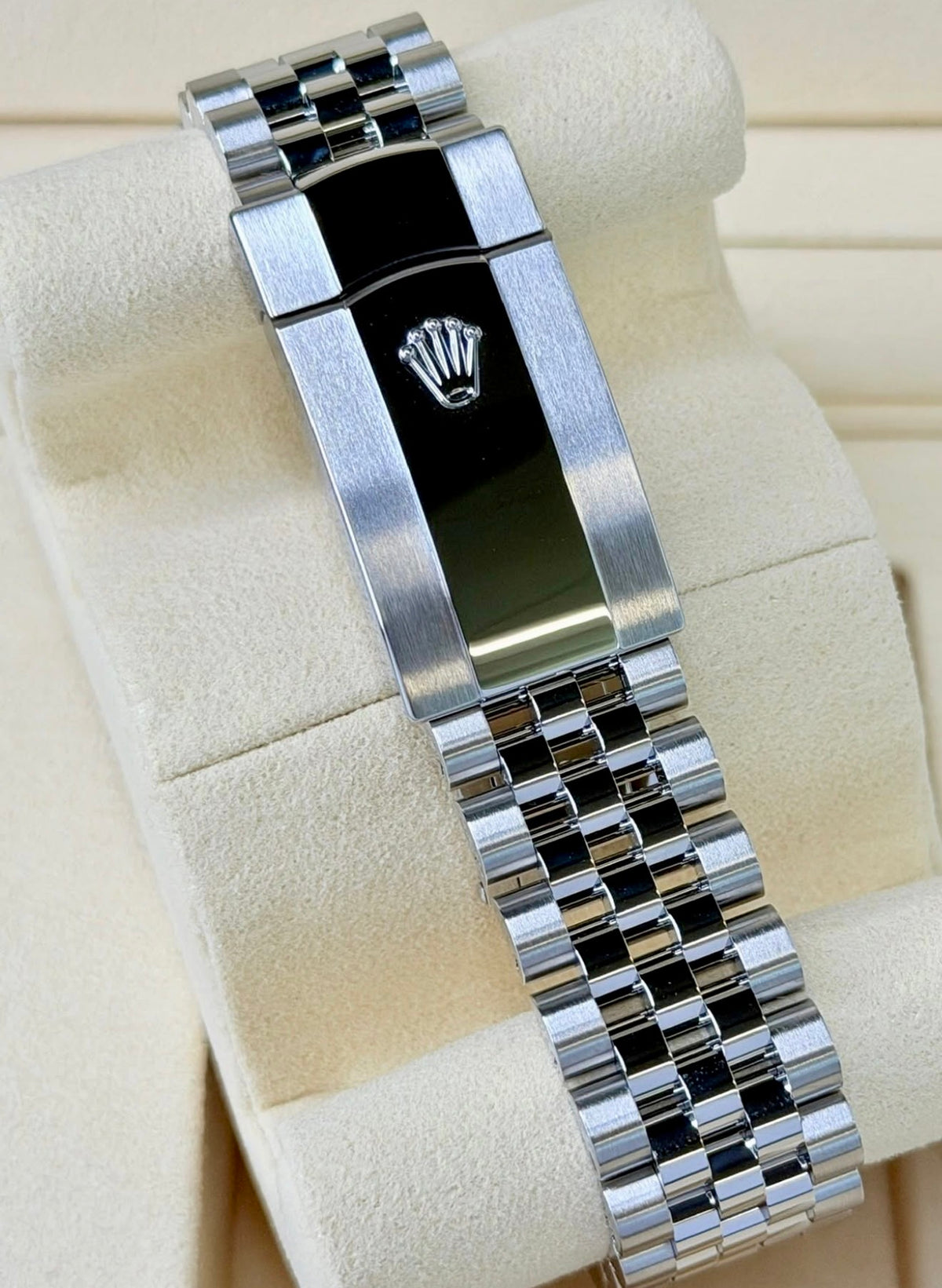 Close-up of the Rolex Datejust 36 126234 Jubilee bracelet clasp with raised Rolex coronet and polished center.